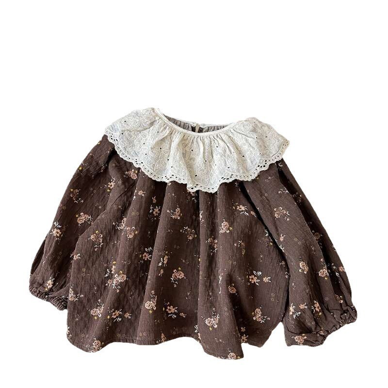 Estrella infantil de otoño 2025 nuevo producto de ropa infantil coreana suelta estilo extranjero de encaje cuello de muñeca de manga larga camisa de niñas