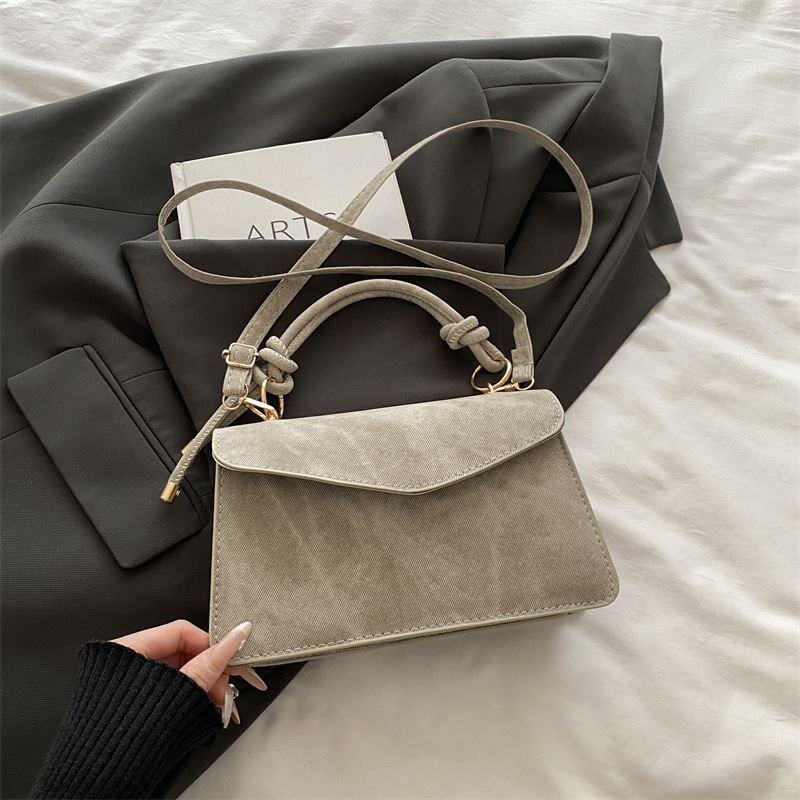 Bolso público pequeño para mujeres 2026 nuevo bolso cuadrado de alta calidad sensación de diseño retro bolso de hombro simple bolso de mano