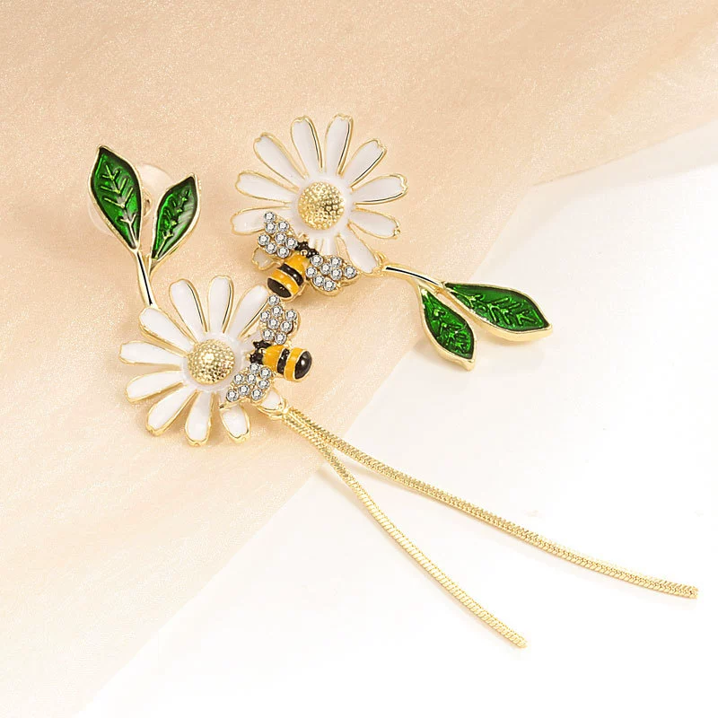 Design asymmetrical earrings, trend of season, flowered