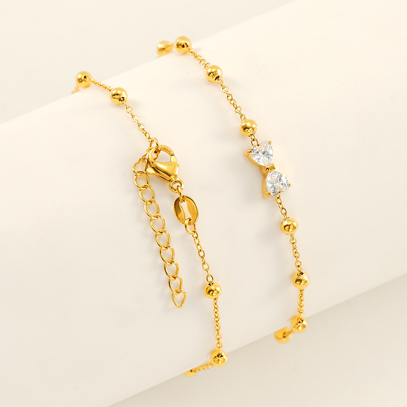 Europa y los Estados Unidos de alto nivel de sensación de arco de acero inoxidable brazalete de lujo ligero joyería dorada brazalete de zircón mujer