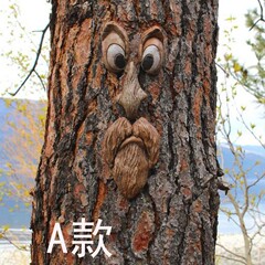 国境を越えて樹皮が光る木の顔の木の奇妙な五感の樹脂がハロウィーンの屋外の創造的な装飾を飾る