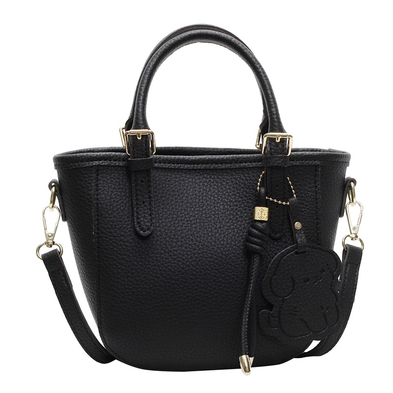 Bolsa de cubo portátil de comercio exterior 2025 nuevo bolso de mochila de textura universal nicho de diseño de red de popularidad explosiva bolso de hombro