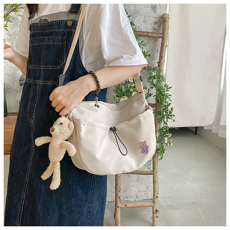 The new 2022 Little Bear canvas small bag for women is simple and versatile. The student dumpling bag is a trendy casual single-shoulder crossbody bag undefined