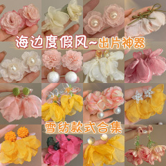 仙気の甘いシフォンの花のイヤリング2025年の新型の洋気の質感のピアスの女性の大衆の設計感の耳飾り