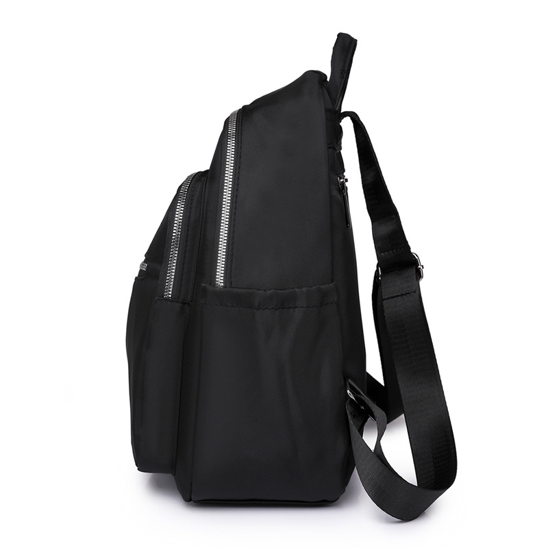 2023 nueva mochila de tela Oxford de color sólido para mujer, arte urbano, viajero, mochila de viaje ligera, mochila escolar al por mayor