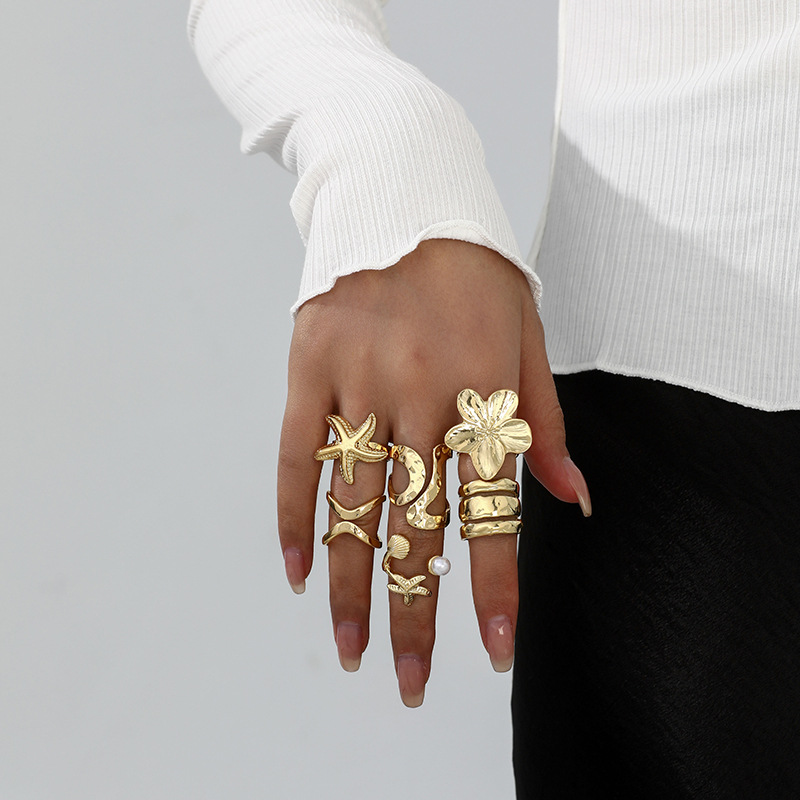 Conjunto de anillo de concha de abanico de concha de viento de vacaciones marinas transfronterizas europeas y americanas