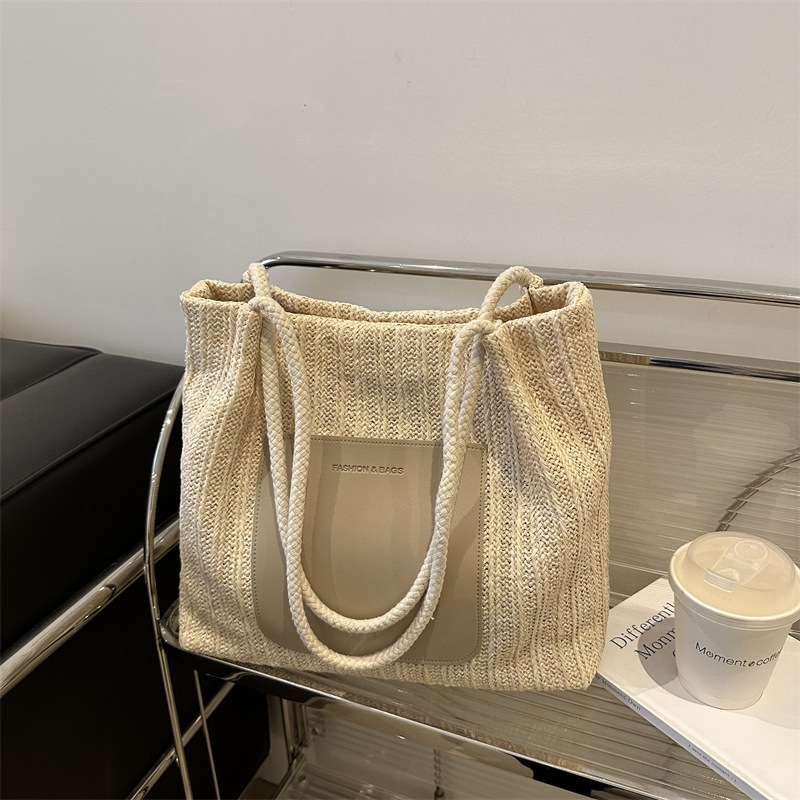 Popular bolsa de tejido de gran capacidad para mujeres 2024 verano nueva bolsa de hombro universal bolsa de viaje de moda