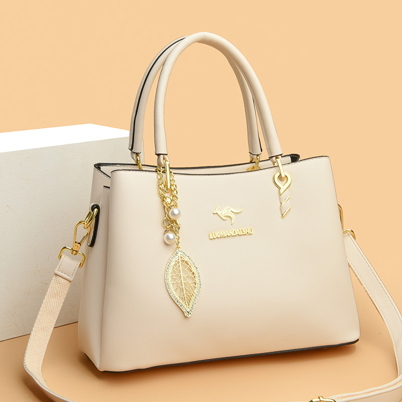 2023 nuevo práctico de gran capacidad simple viajero bolsa de mensajero de las mujeres bolsa de tres capas boca brillante cuero suave entrega de una pieza