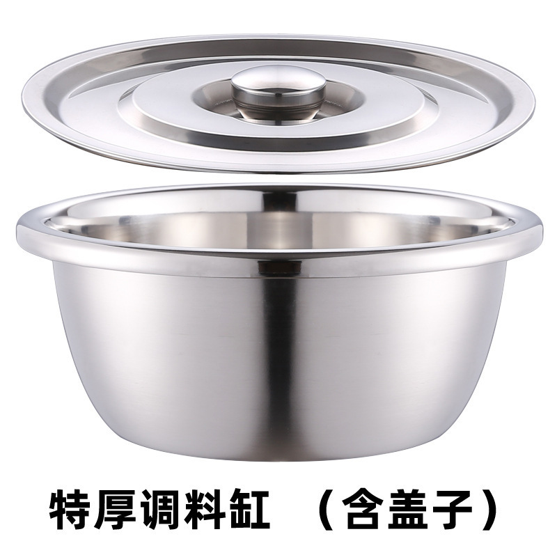 厚いステンレスのたらいは蓋と洗面器の洗面器を持っています。|undefined
