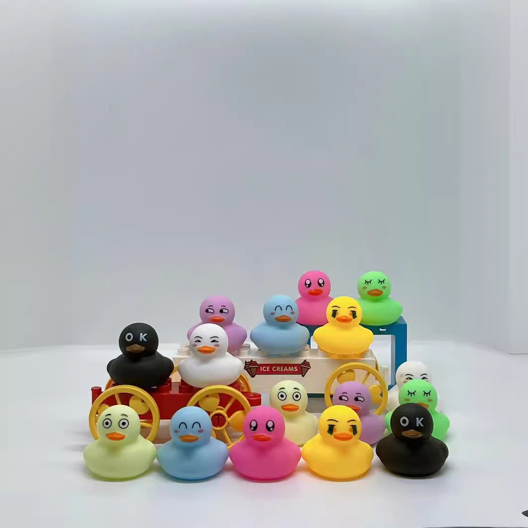 Cute little yellow duck pinch called Internet celebrity facial expression duck water toy bath artifact BB ring cute animal gift