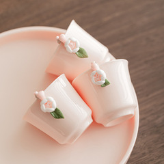 ピンクの茶器セット家庭用陶磁器ティーポットの梁壺女子学生はお茶を飲みます。