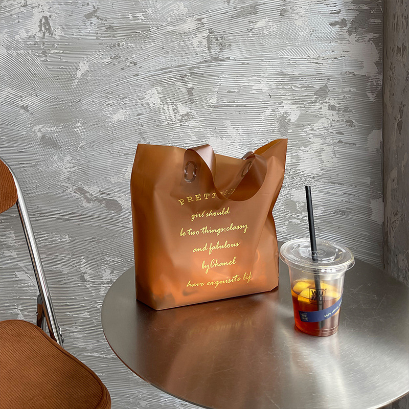 直销加厚磨砂手提袋咖啡色服装店袋子女装购物包装塑料袋可印logo