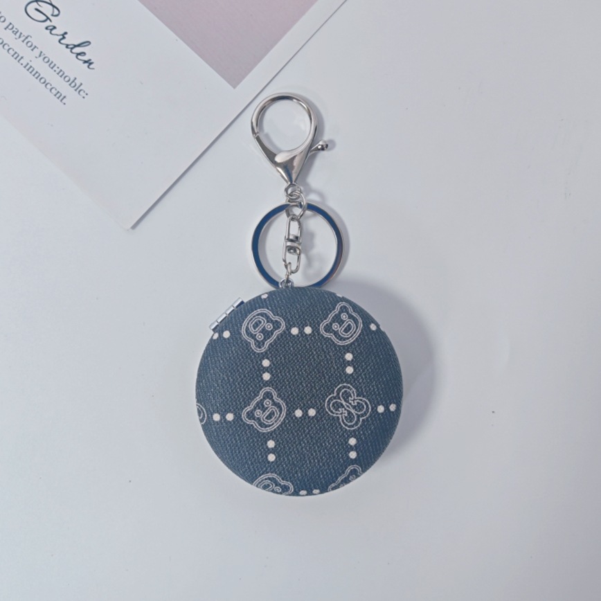 Bolsa de espejo popular en línea colgante de lujo ligero llavero portátil espejo de maquillaje transfronterizo colgante de bolsas de espejo doble cara