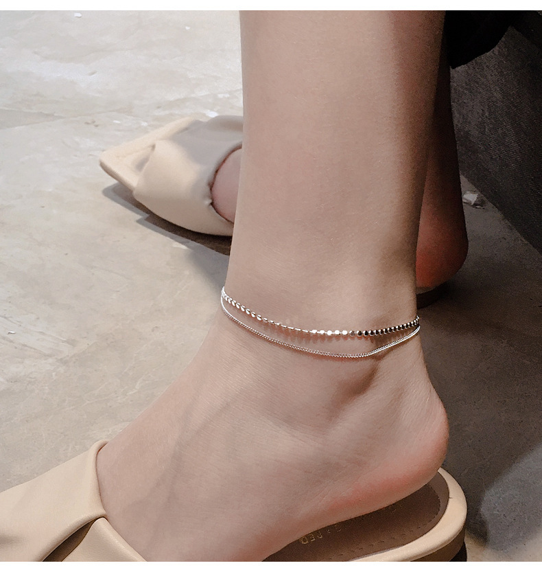 Cavigliera da donna con ciondoli a sole e dischi, gioiello moda_voghion.com