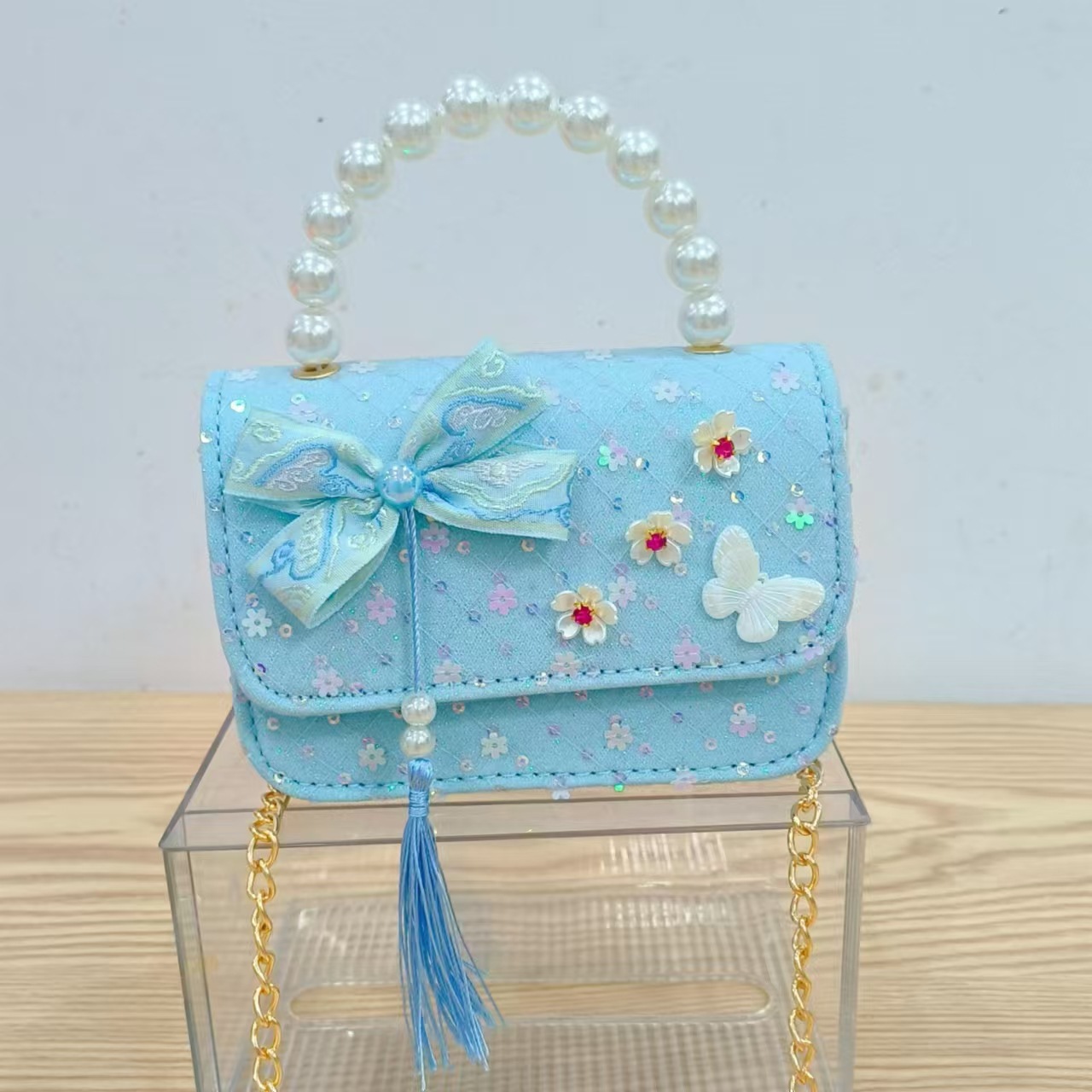 Niños pequeños viento fragrante hombro alto sentido de la chica antigua bolso de cambio princesa perla accesorios de ropa china portátil mochila