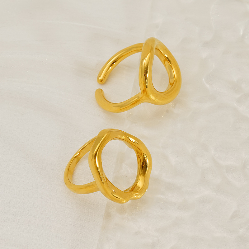 Diseño sentido geométrico anillo de anillo hueco de acero inoxidable al por mayor transfronterizo europeo y americano anudado cruzado anillo de acero de titanio femenino