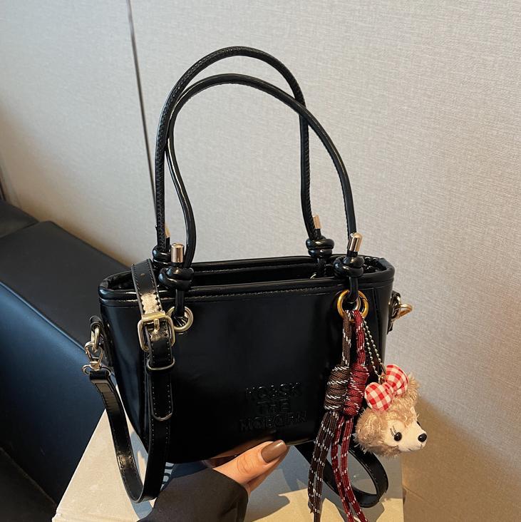 Bolsa de cubo retro explosiva para mujeres 2025 nuevo bolso de nicho de diseño de alta humedad versátil bolso de hombro