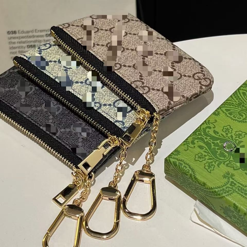 Fabricantes lotes de bolsas de cambio bolsas de lápiz labial bolsas de llaves colgantes bolsas de tarjetas de moda europeas y estadounidenses colgantes abejas GG