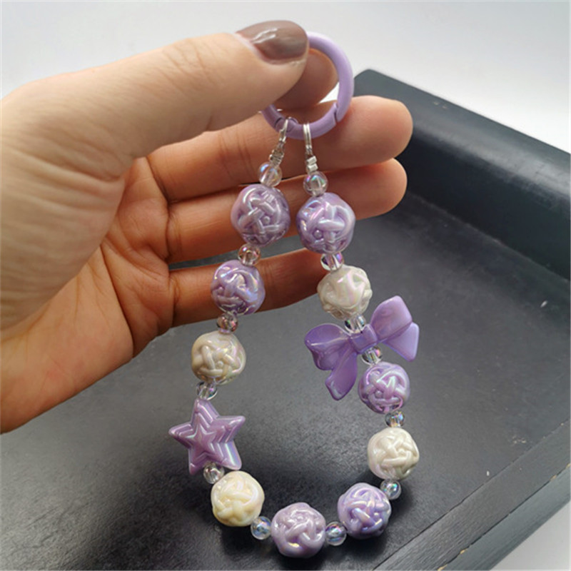 Colgante de estrella de cinco puntas con lazo púrpura