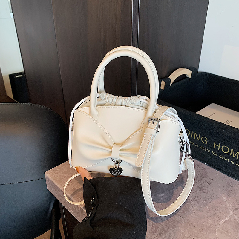 Bolso de moda coreano 2025 verano nuevo bolso femenino diseño de nicho bolso de hombro lindo lazo bolso de mensajero