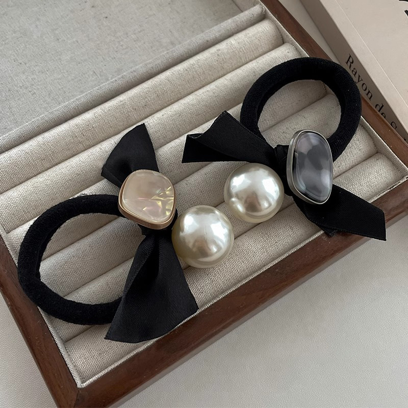 Arco negro coreano anillo de cabello de perla banda elástica de alta elasticidad para mujeres 2025 nuevos adornos de cabello de cabello de cuerda de cabeza