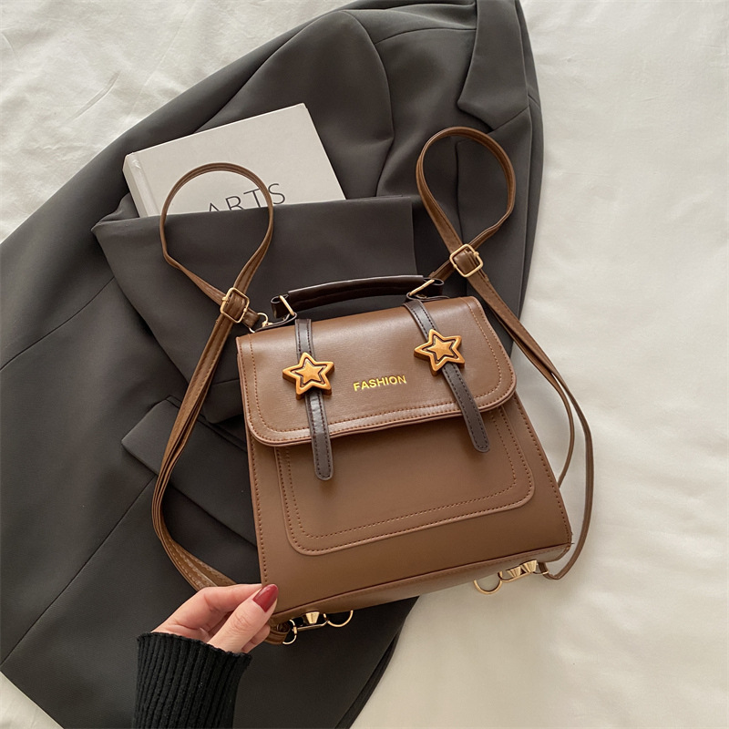 Mochila retro versátil para mujeres nicho diseño 2024 nueva moda alta textura mochila universitaria pequeña