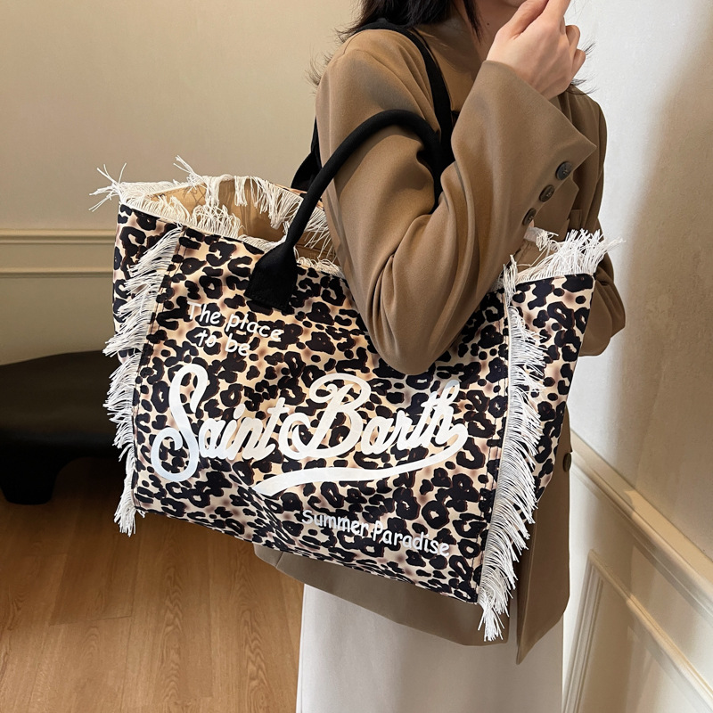 Bolso de moda coreano de moda de verano 2025, nuevo bolso de mano de leopardo personalizado, bolso de hombro retro de gran capacidad.