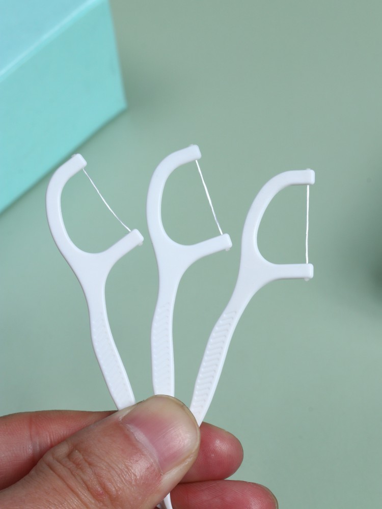 Wholesale of 50-piece dental floss boxes, ultra-fine dental floss picks, family-sized plastic toothpicks, bow-shaped portable box dental floss pic 3