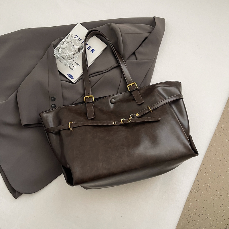 Bolsos de mujer Bolsos de alta capacidad portátiles de todo fósforo 2025 nuevo estilo retro moda casual bolso de hombro sentido bolso de mujer