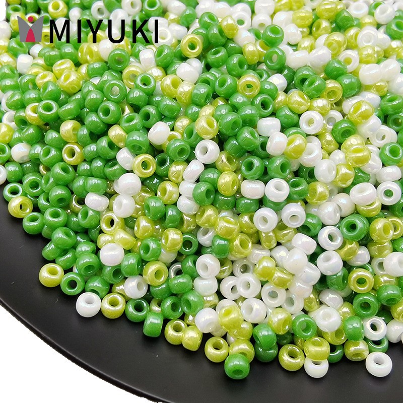 MIYUKI Yuki Japón importación de 2mm de alto brillo esmalte de vidrio de color arroz cuentas hechas a mano DIY material de collar de pulseras de cuentas