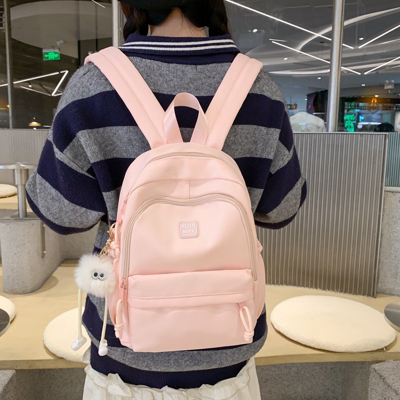 La nueva mochila simple y versátil de gran capacidad Mori es una mochila de estilo universitario pequeña y fresca, bolsa de computadora de viaje