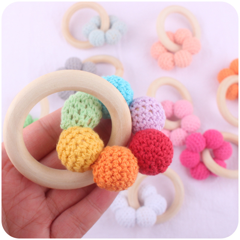 Nuevo bebé suministros Hemu teether pulsera bebé cuentas de lana flor juguete dientes molienda palo AliExpress