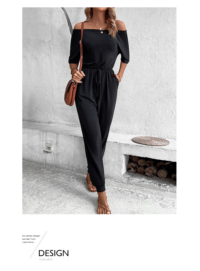 Tuta nera con pantaloni a nove punte con spalle scoperte e una linea_voghion.com