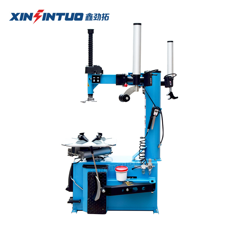 Desmontadora de neumáticos totalmente automática Jintuo, máquina desmontadora de neumáticos potente a prueba de explosiones con brazos auxiliares duales y sistema neumático.