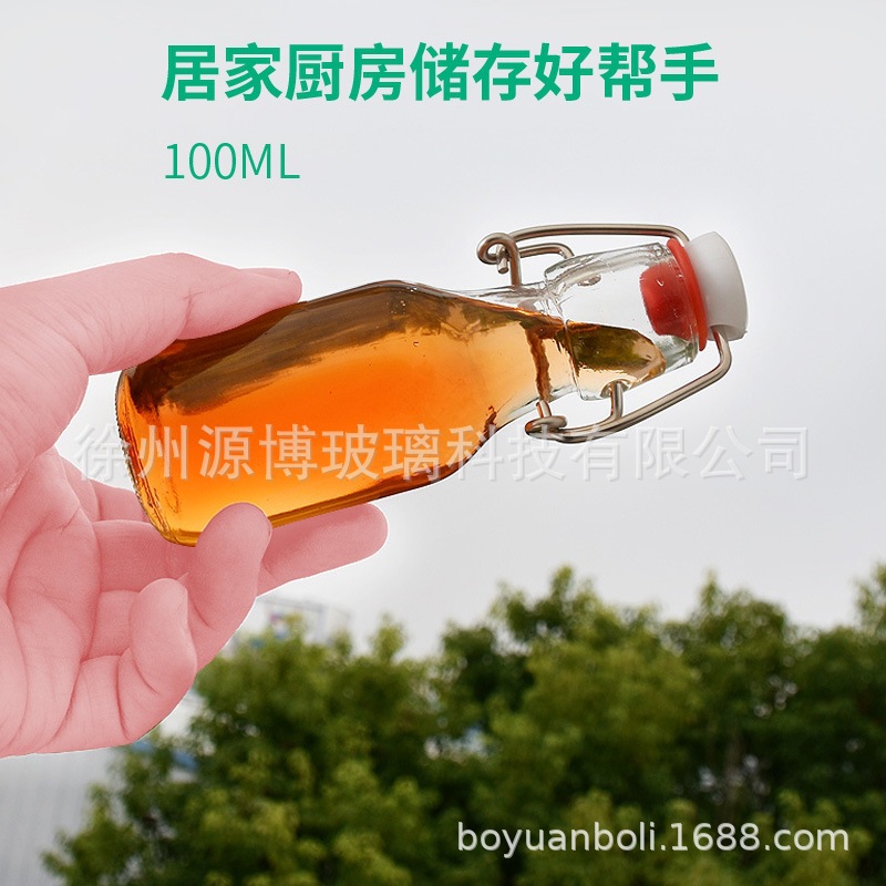 Amazon pequeña hebilla 60ml botella de vidrio pequeña botella de vino botella de bebida enzimática aceite comestible aceite de Camelia sub-botella al por mayor