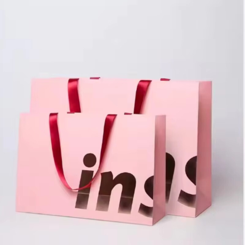 Luxury Cosmetics Pink Ribbon Shopping Paper Bag Pink Packaging Gift Bag Shopping Cardboard Bag with Handle for Clothes Luxury Cosmetics Pink Ribbon Shopping Paper Bag Pink Packaging Gift Bag Shopping Cardboard Bag with Handle for Clothes