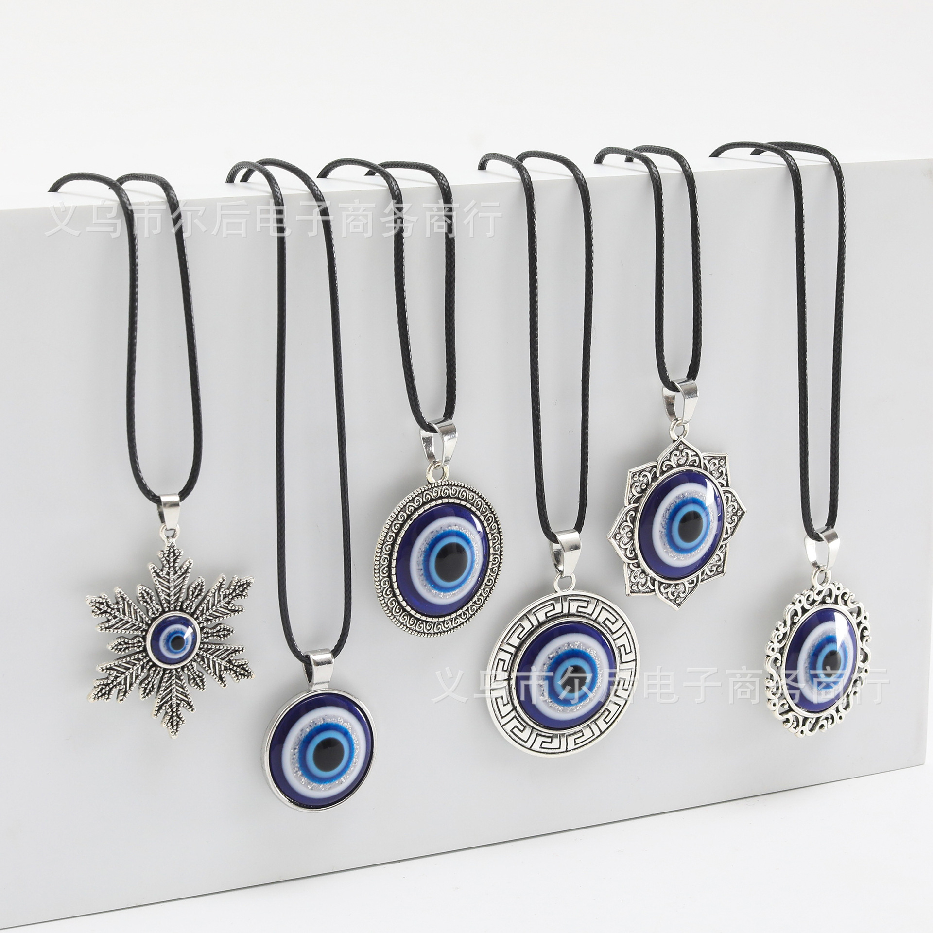 Joyas transfronterizas europeas y americanas retro turcas aleación redonda azul colgante ojo del diablo colgante ojos azules al por mayor