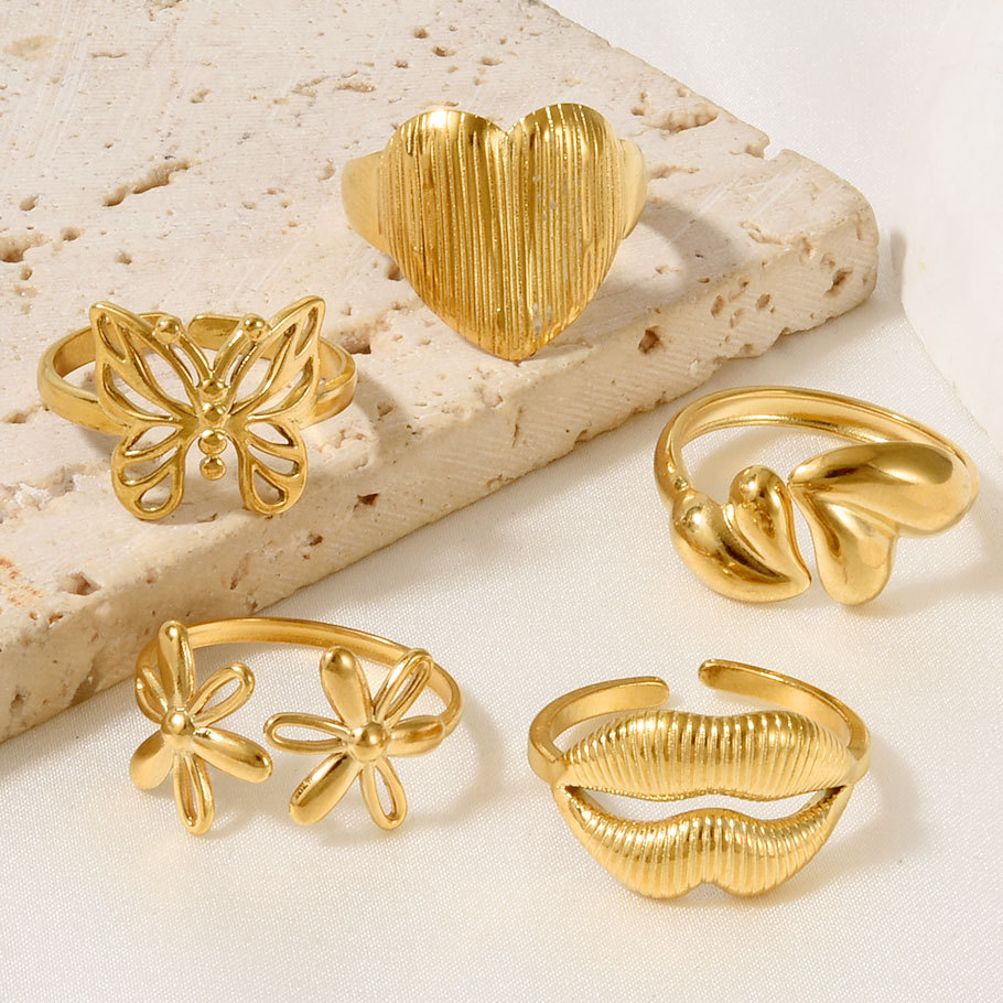 High-end Stainless Steel Couple Ring 18k Gold Hollow Pattern_voghion.com