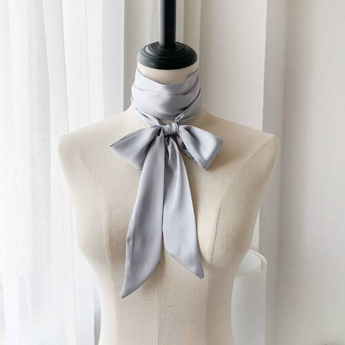 A long 2-meter solid-color silk scarf French-style elegant collar dress with bow accessories, thin headband, bundled bag, ribbon.