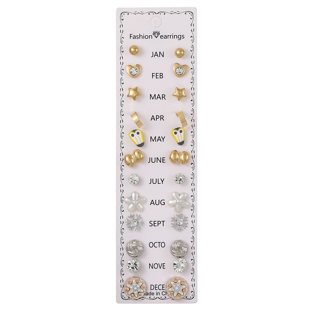 Set de 12 pares de aretes con flores y diamantes
