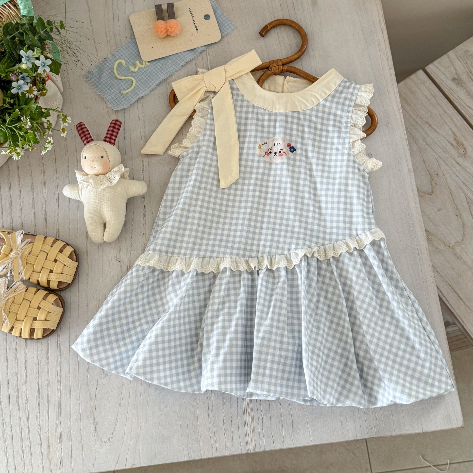 Vestido de siete niñas de limón salado verano versión coreana de dulce lazo azul a cuadros bebé lindo chaleco de capullo de flor falda de moda