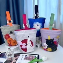 冬季新款复古印花帆布水桶包简约美观小众高级感敞口伴手礼手提袋