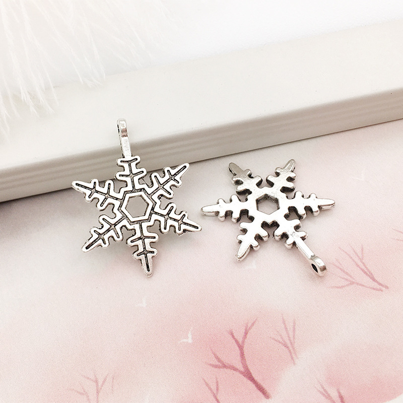 1 copo de nieve aleación colgante DIY aleación joyería brillante plata hueco copo de nieve colgante transfronterizo Amazon Venta caliente