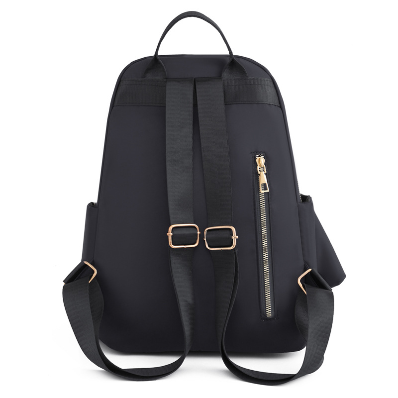 Comercio exterior al por mayor 2023 nueva mochila de nailon para mujer coreana, mochila de viaje al aire libre de todo fósforo de moda