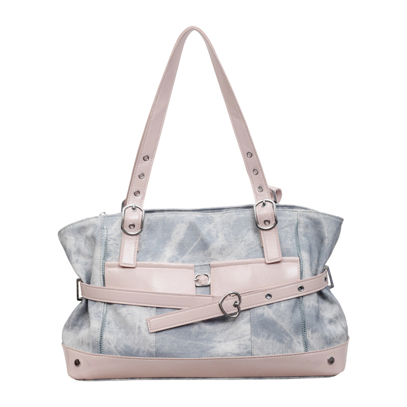 Bolsa de motocicleta de chicas calientes retro para mujeres 2026 verano nuevo nicho de lujo ligero bolso de hombro de brazo bolso de viaje transfronterizo