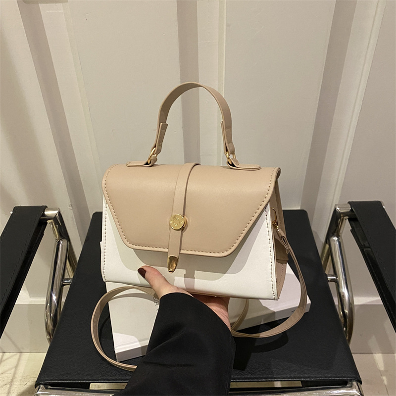 Bolsa de mano de textura de empalme retro para mujeres 2025 nuevo estilo simple y casual de moda extranjera bolso de hombro