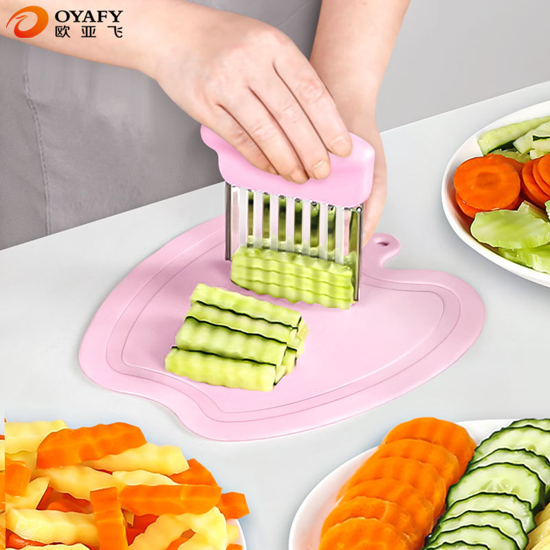 ステンレスの波のマッシュポテトは果物と野菜を切って切ります。|undefined