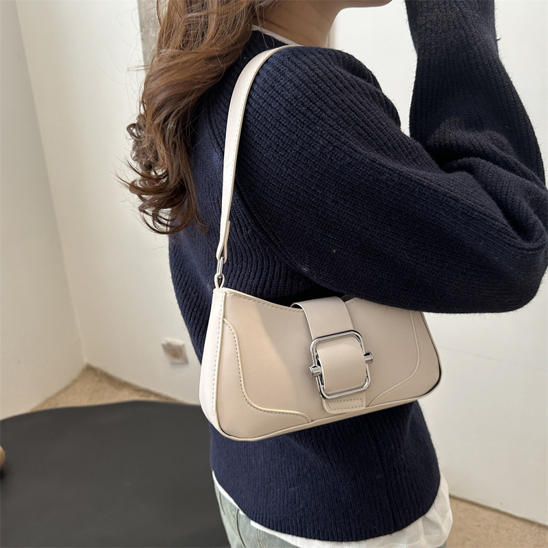 Versión coreana del bolso de axila de alta gama, popular de este año, bolso de palo francés de estilo occidental, diseño de nicho, bolso de hombro de temperamento de moda, viaje