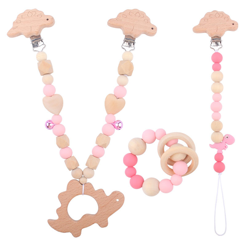Suministros para bebés pulsera de silicona molar de juguete para niños Cadena de cochecito de dinosaurio de tres piezas creativa pequeña campana colgante
