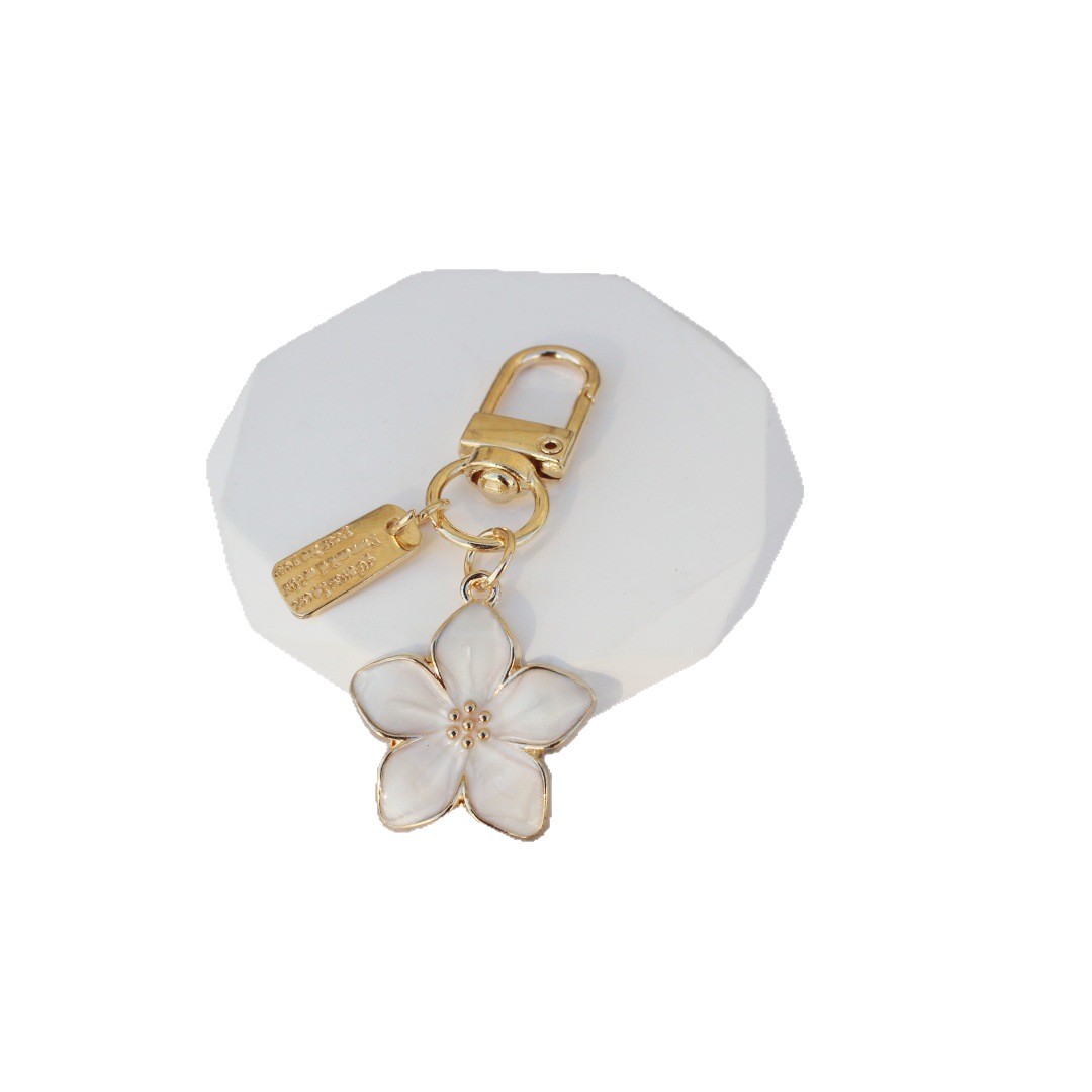 Nueva venta caliente transfronteriza, estilo caliente, flor de cinco hojas coreana, flor de pera, colgante, llavero, bolso Zou Ju, colgante, regalo pequeño image 5